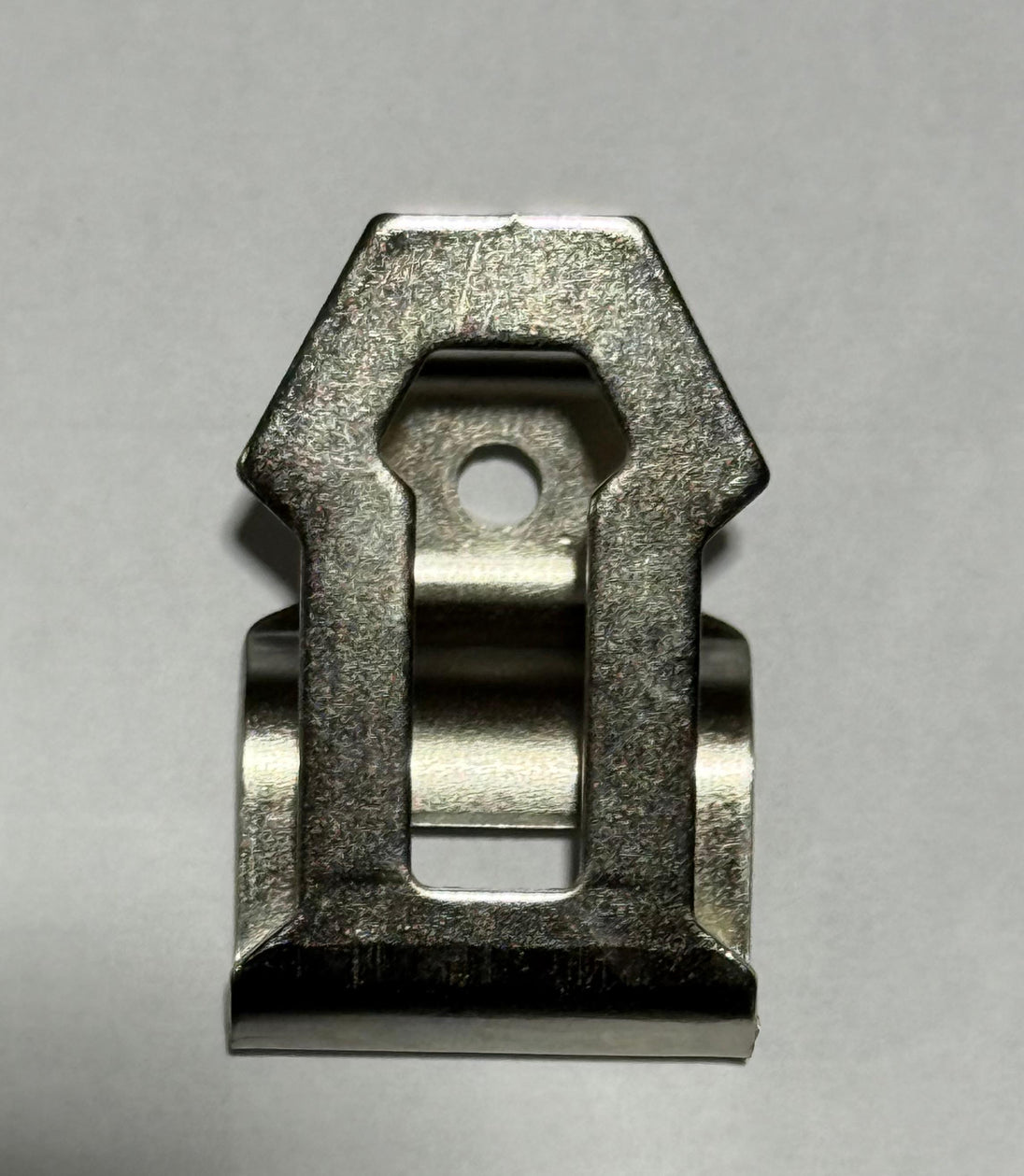 Metallic clip on a gray background