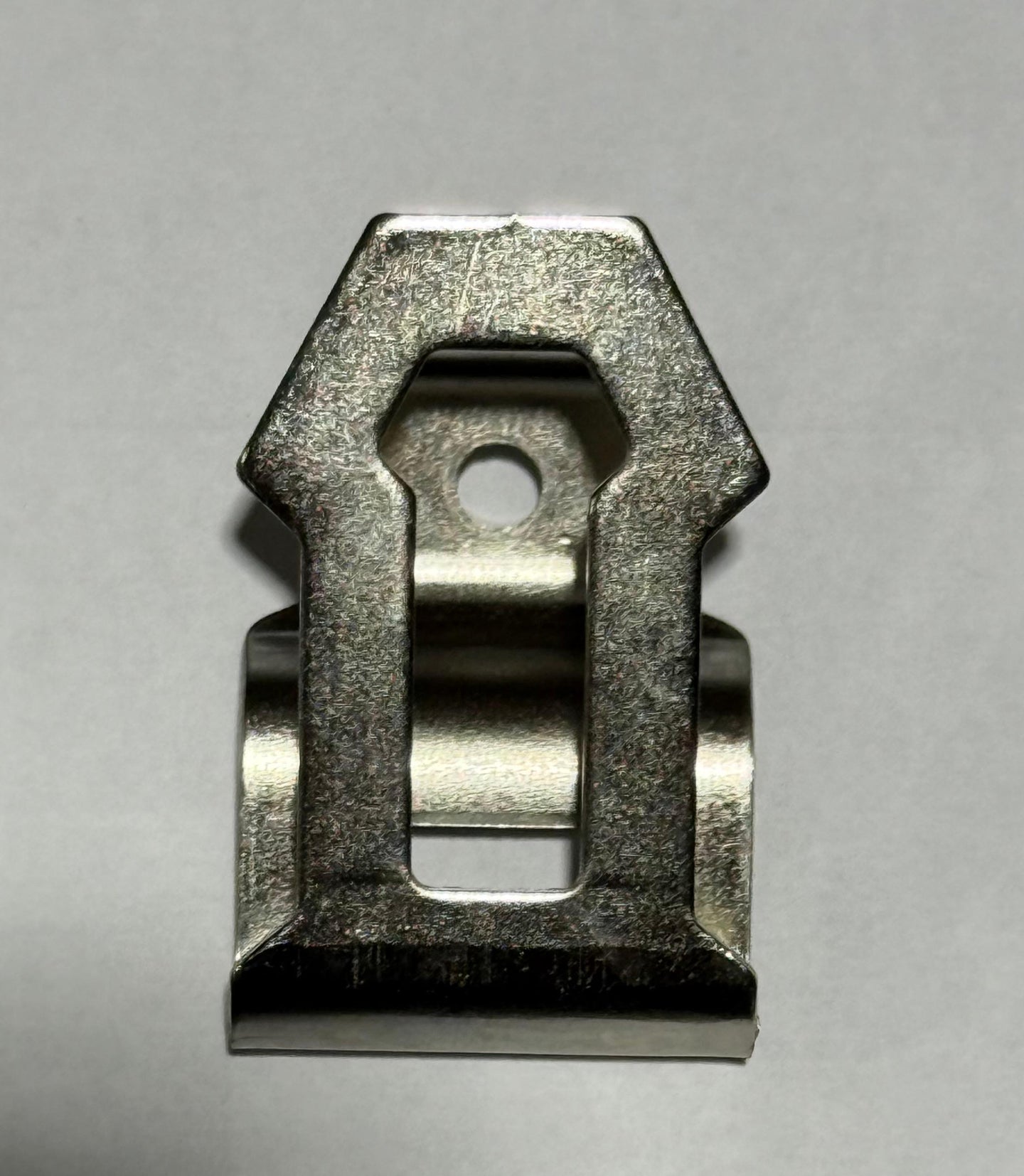 Metallic clip on a gray background