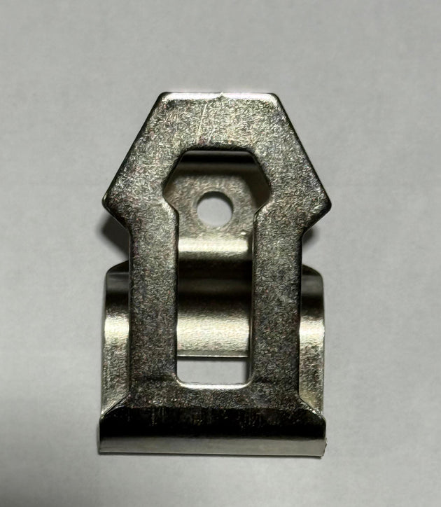 Metallic clip on a gray background